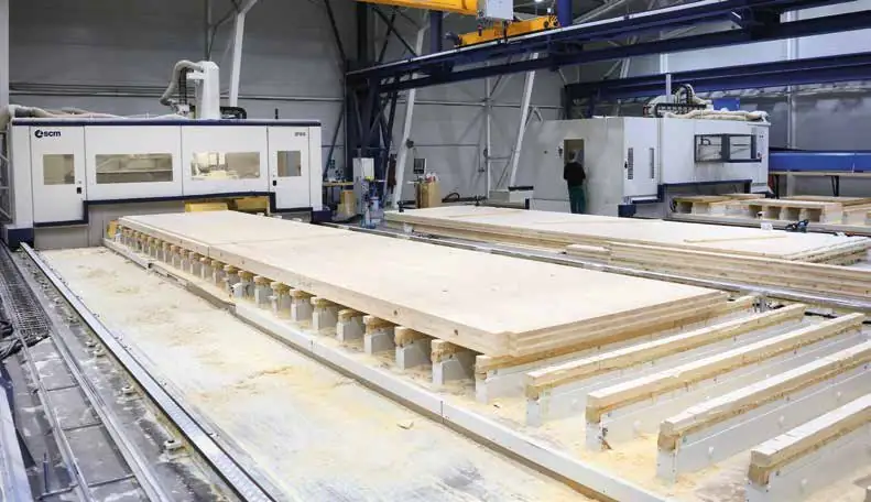 Large timber panel on the work table of the SCM AREA CNC centre